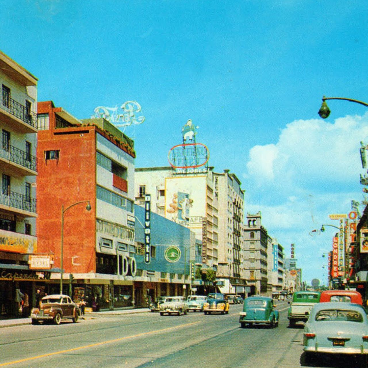 A postcard from Mexico dated circa 1950s showing a sunny downtown street scene.