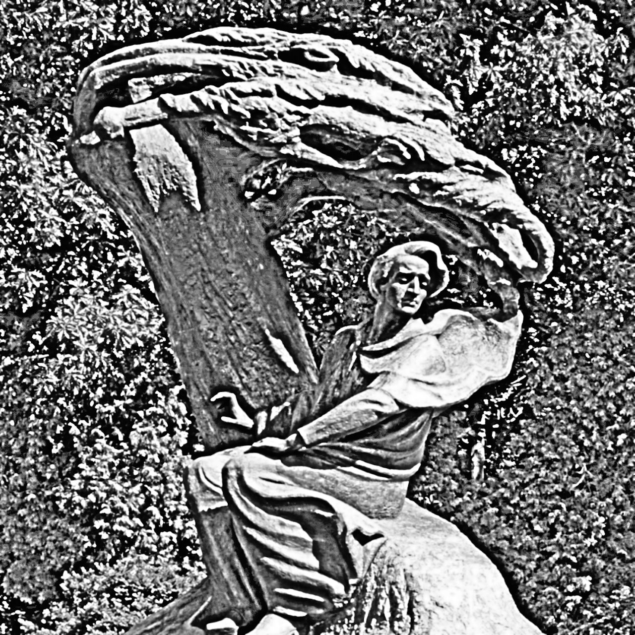 A monochromatic photograph of a statue of Chopin with a find edges filter applied to it.